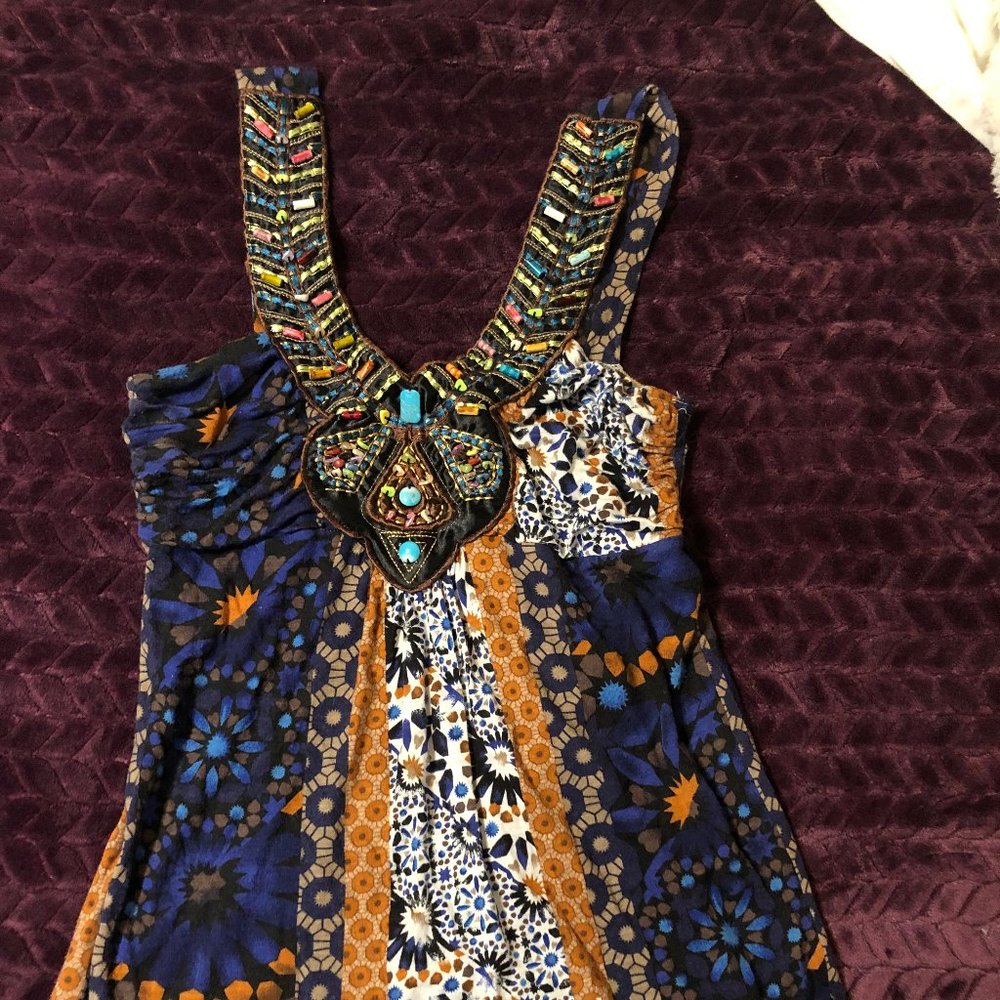 Embroidered and beaded tank top.